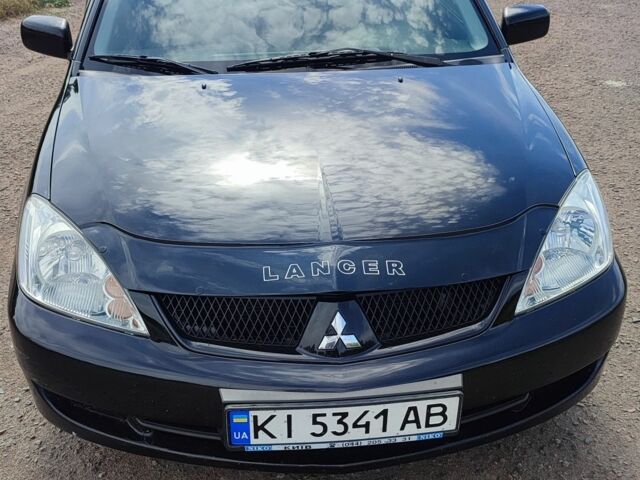 Черный Мицубиси Лансер, объемом двигателя 1.6 л и пробегом 207 тыс. км за 4300 $, фото 1 на Automoto.ua