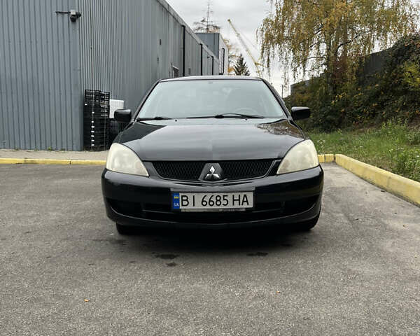 Чорний Міцубісі Lancer, об'ємом двигуна 1.58 л та пробігом 192 тис. км за 4500 $, фото 1 на Automoto.ua