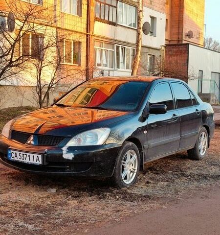Чорний Міцубісі Lancer, об'ємом двигуна 1.58 л та пробігом 162 тис. км за 2950 $, фото 1 на Automoto.ua
