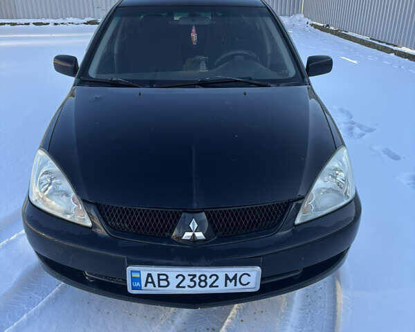 Чорний Міцубісі Lancer, об'ємом двигуна 1.6 л та пробігом 230 тис. км за 3200 $, фото 1 на Automoto.ua