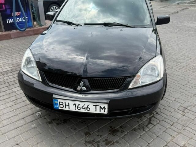 Чорний Міцубісі Lancer, об'ємом двигуна 1.58 л та пробігом 320 тис. км за 5000 $, фото 1 на Automoto.ua