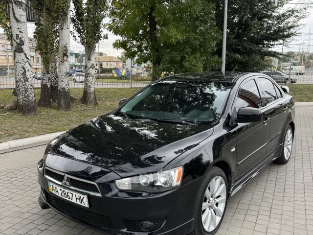 Черный Мицубиси Лансер, объемом двигателя 2 л и пробегом 200 тыс. км за 6800 $, фото 1 на Automoto.ua