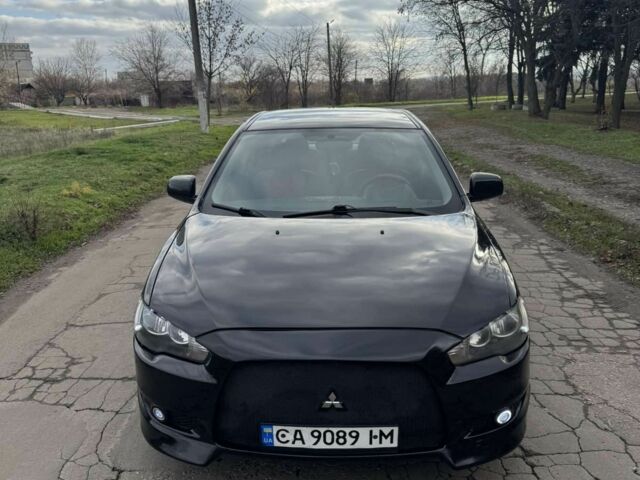 Чорний Міцубісі Lancer, об'ємом двигуна 2 л та пробігом 248 тис. км за 4999 $, фото 1 на Automoto.ua