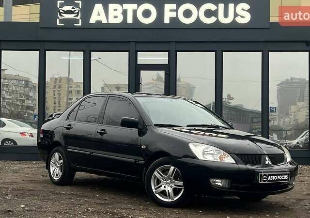 Чорний Міцубісі Lancer, об'ємом двигуна 1.6 л та пробігом 340 тис. км за 6190 $, фото 1 на Automoto.ua