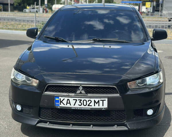 Черный Мицубиси Лансер, объемом двигателя 2 л и пробегом 295 тыс. км за 7000 $, фото 1 на Automoto.ua