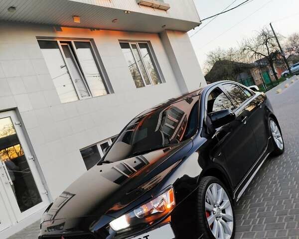 Черный Мицубиси Лансер, объемом двигателя 2 л и пробегом 220 тыс. км за 8300 $, фото 1 на Automoto.ua