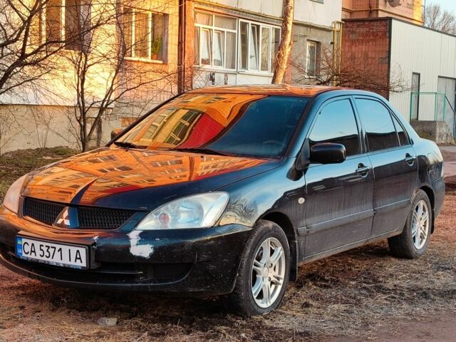 Черный Мицубиси Лансер, объемом двигателя 1.6 л и пробегом 162 тыс. км за 3150 $, фото 1 на Automoto.ua