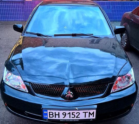 Черный Мицубиси Лансер, объемом двигателя 1.6 л и пробегом 205 тыс. км за 5500 $, фото 1 на Automoto.ua