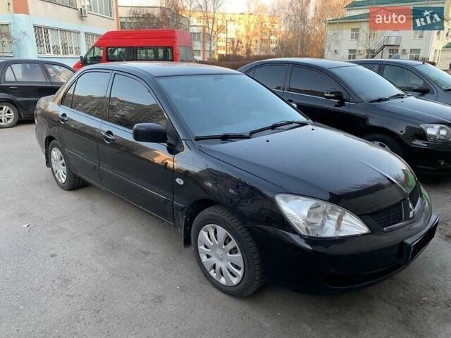 Черный Мицубиси Лансер, объемом двигателя 1.58 л и пробегом 250 тыс. км за 4900 $, фото 1 на Automoto.ua