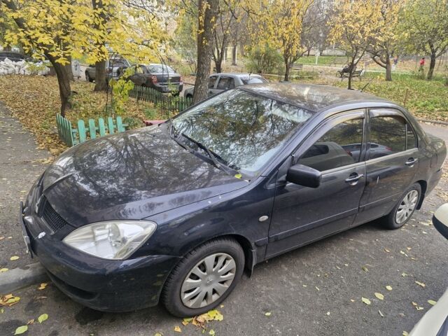 Черный Мицубиси Лансер, объемом двигателя 1.6 л и пробегом 243 тыс. км за 2900 $, фото 1 на Automoto.ua