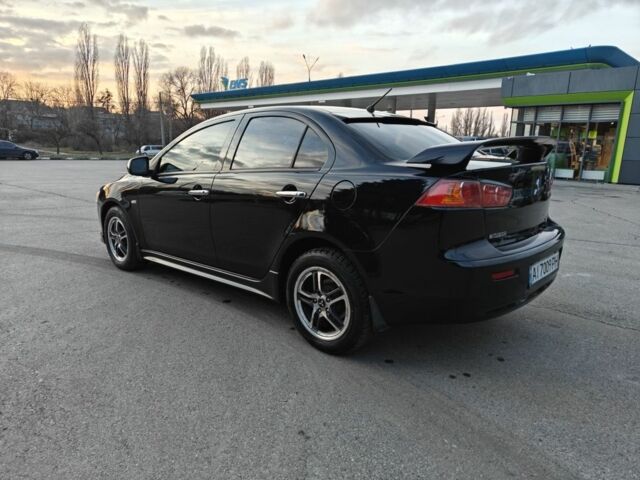 Черный Мицубиси Лансер, объемом двигателя 2 л и пробегом 245 тыс. км за 5600 $, фото 1 на Automoto.ua