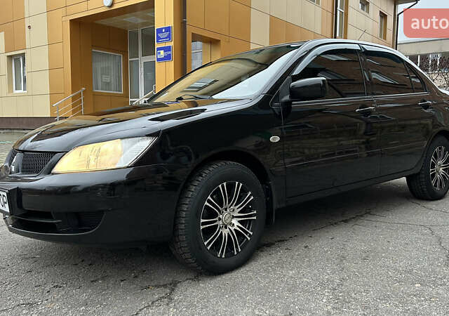 Чорний Міцубісі Lancer, об'ємом двигуна 1.58 л та пробігом 167 тис. км за 4800 $, фото 1 на Automoto.ua