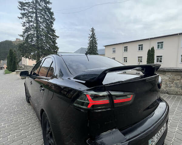 Черный Мицубиси Лансер, объемом двигателя 2 л и пробегом 165 тыс. км за 6900 $, фото 1 на Automoto.ua