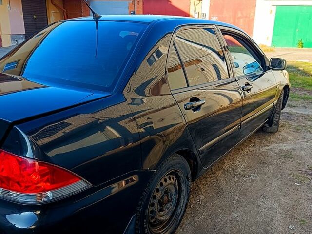 Чорний Міцубісі Lancer, об'ємом двигуна 1.6 л та пробігом 230 тис. км за 4700 $, фото 1 на Automoto.ua