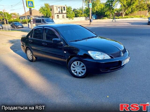 Черный Мицубиси Лансер, объемом двигателя 1.6 л и пробегом 216 тыс. км за 4500 $, фото 1 на Automoto.ua