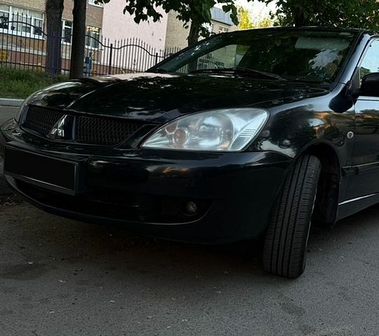 Чорний Міцубісі Lancer, об'ємом двигуна 1.6 л та пробігом 486 тис. км за 3600 $, фото 1 на Automoto.ua