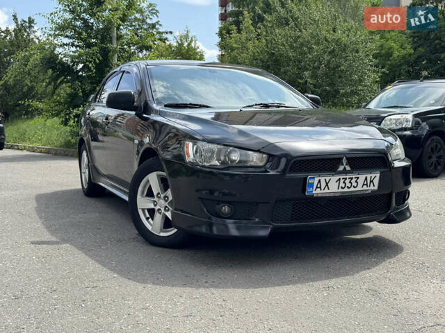Черный Мицубиси Лансер, объемом двигателя 2 л и пробегом 234 тыс. км за 7400 $, фото 1 на Automoto.ua