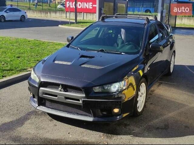 Чорний Міцубісі Lancer, об'ємом двигуна 2 л та пробігом 134 тис. км за 29034 $, фото 1 на Automoto.ua