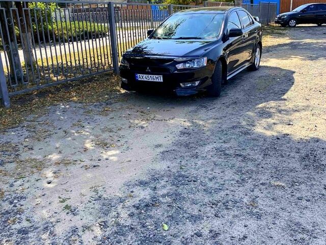 Черный Мицубиси Лансер, объемом двигателя 2 л и пробегом 156 тыс. км за 7100 $, фото 1 на Automoto.ua