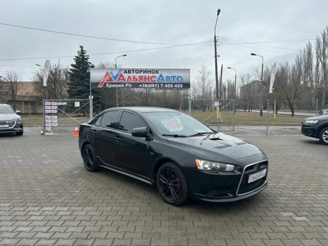 Черный Мицубиси Лансер, объемом двигателя 2 л и пробегом 213 тыс. км за 7400 $, фото 1 на Automoto.ua