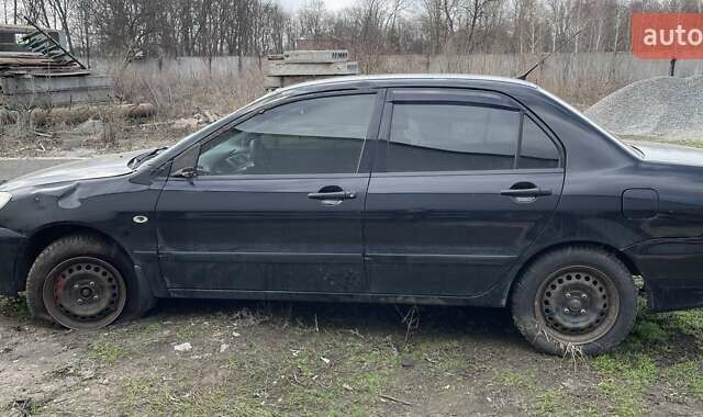 Чорний Міцубісі Lancer, об'ємом двигуна 1.6 л та пробігом 216 тис. км за 1800 $, фото 1 на Automoto.ua