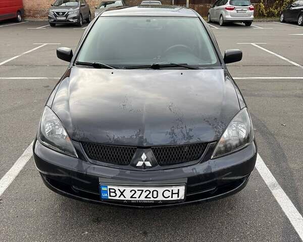 Чорний Міцубісі Lancer, об'ємом двигуна 1.6 л та пробігом 245 тис. км за 4500 $, фото 1 на Automoto.ua