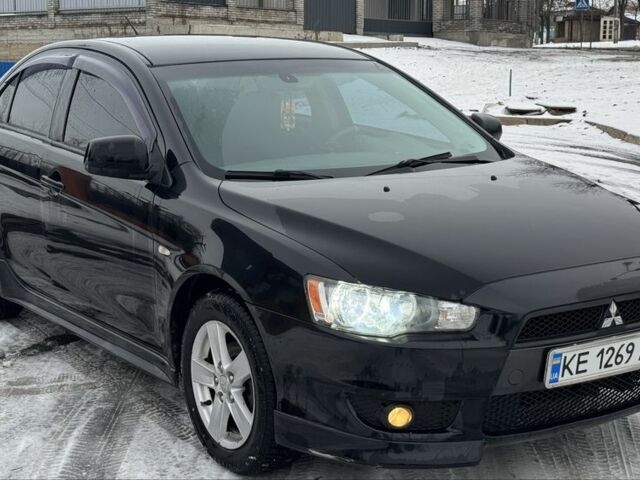 Черный Мицубиси Лансер, объемом двигателя 2 л и пробегом 280 тыс. км за 6800 $, фото 1 на Automoto.ua