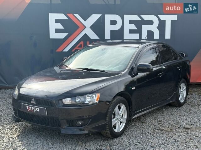Черный Мицубиси Лансер, объемом двигателя 2 л и пробегом 245 тыс. км за 5990 $, фото 1 на Automoto.ua