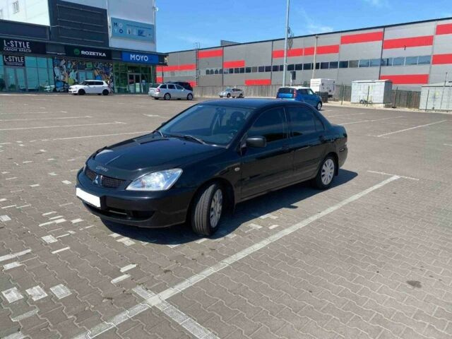 Чорний Міцубісі Lancer, об'ємом двигуна 1.6 л та пробігом 229 тис. км за 4200 $, фото 1 на Automoto.ua
