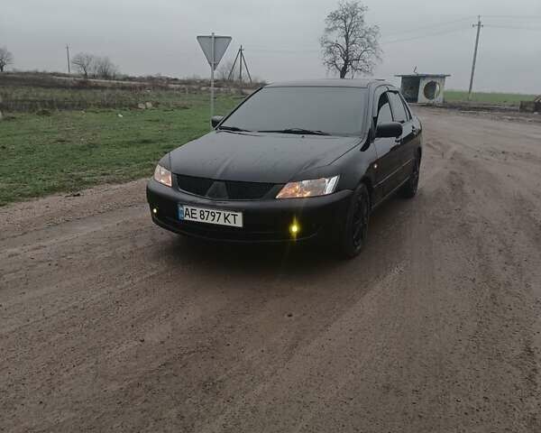 Чорний Міцубісі Lancer, об'ємом двигуна 1.58 л та пробігом 233 тис. км за 4800 $, фото 1 на Automoto.ua