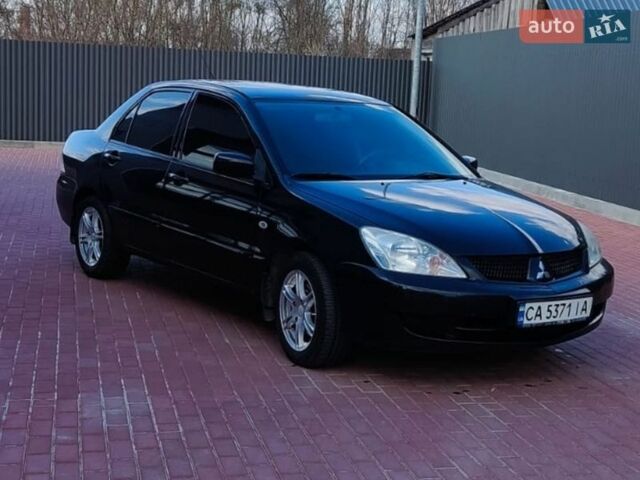 Черный Мицубиси Лансер, объемом двигателя 1.6 л и пробегом 409 тыс. км за 3300 $, фото 1 на Automoto.ua