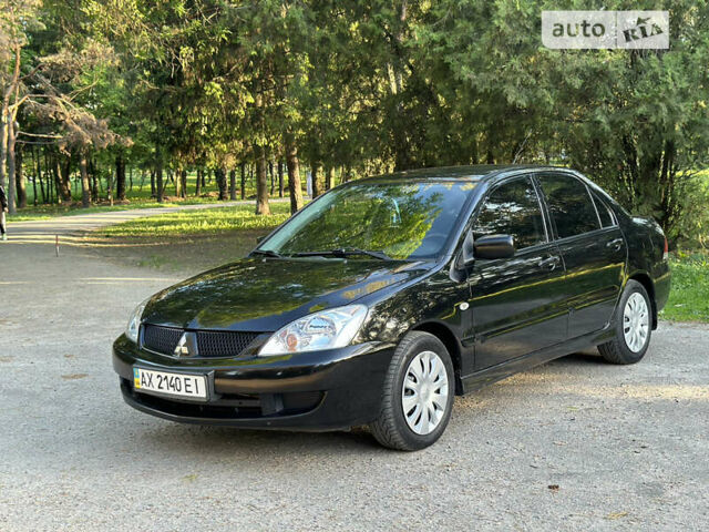 Чорний Міцубісі Lancer, об'ємом двигуна 1.6 л та пробігом 182 тис. км за 4999 $, фото 1 на Automoto.ua