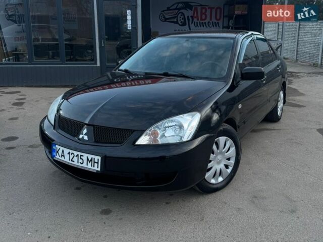 Черный Мицубиси Лансер, объемом двигателя 1.58 л и пробегом 305 тыс. км за 5800 $, фото 1 на Automoto.ua