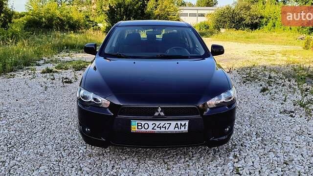 Черный Мицубиси Лансер, объемом двигателя 2 л и пробегом 204 тыс. км за 6700 $, фото 1 на Automoto.ua