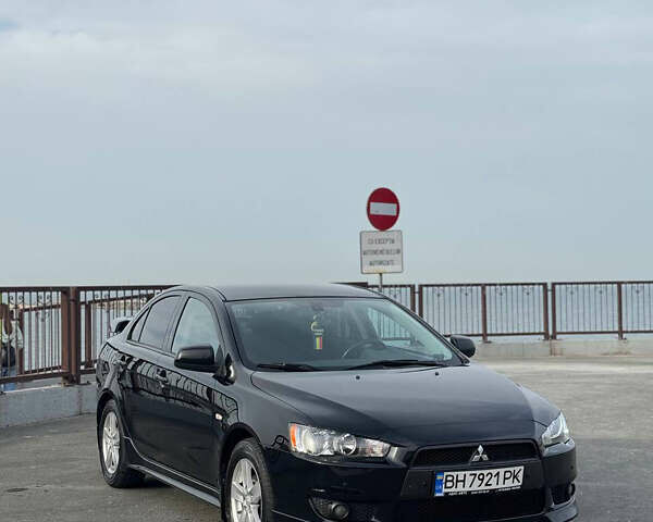 Черный Мицубиси Лансер, объемом двигателя 2 л и пробегом 104 тыс. км за 7600 $, фото 1 на Automoto.ua