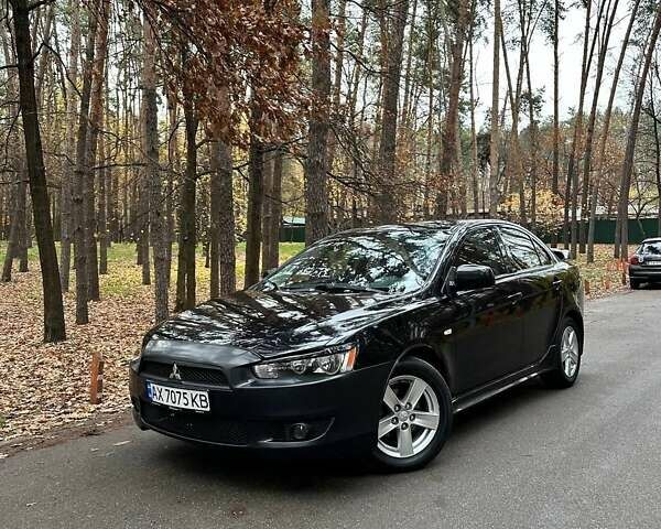 Черный Мицубиси Лансер, объемом двигателя 2 л и пробегом 216 тыс. км за 5600 $, фото 1 на Automoto.ua