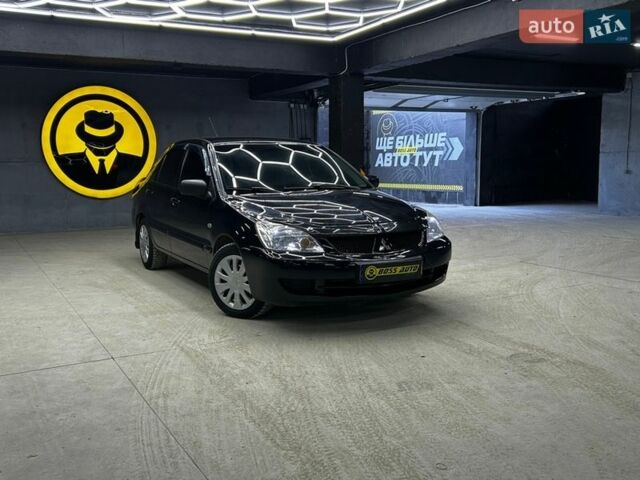 Черный Мицубиси Лансер, объемом двигателя 1.58 л и пробегом 286 тыс. км за 5900 $, фото 1 на Automoto.ua