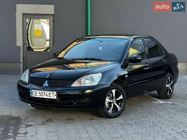 Чорний Міцубісі Lancer, об'ємом двигуна 1.6 л та пробігом 227 тис. км за 3900 $, фото 1 на Automoto.ua