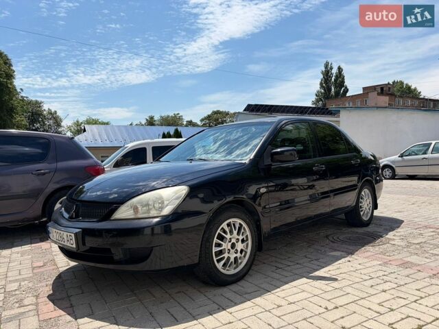 Черный Мицубиси Лансер, объемом двигателя 1.58 л и пробегом 250 тыс. км за 3999 $, фото 1 на Automoto.ua