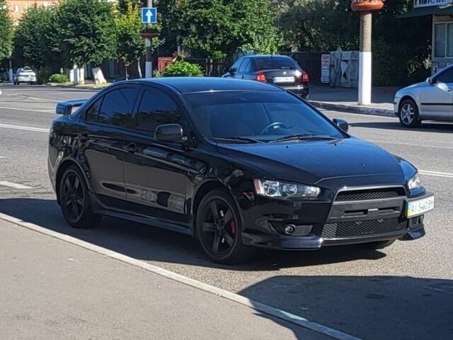 Чорний Міцубісі Lancer, об'ємом двигуна 2 л та пробігом 300 тис. км за 8300 $, фото 1 на Automoto.ua