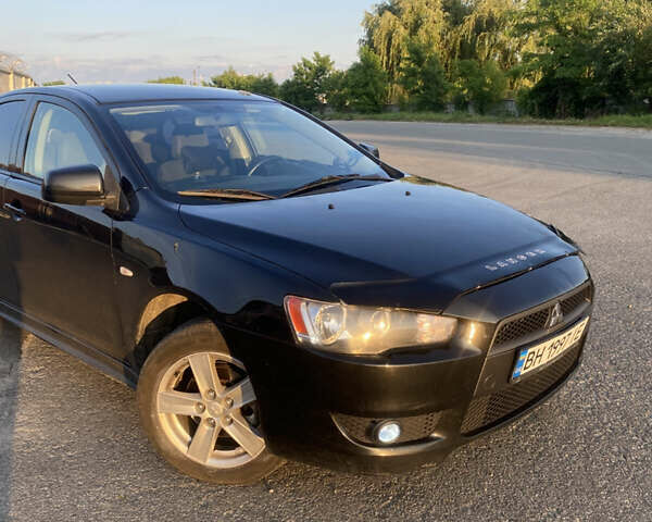 Черный Мицубиси Лансер, объемом двигателя 2 л и пробегом 190 тыс. км за 6750 $, фото 1 на Automoto.ua