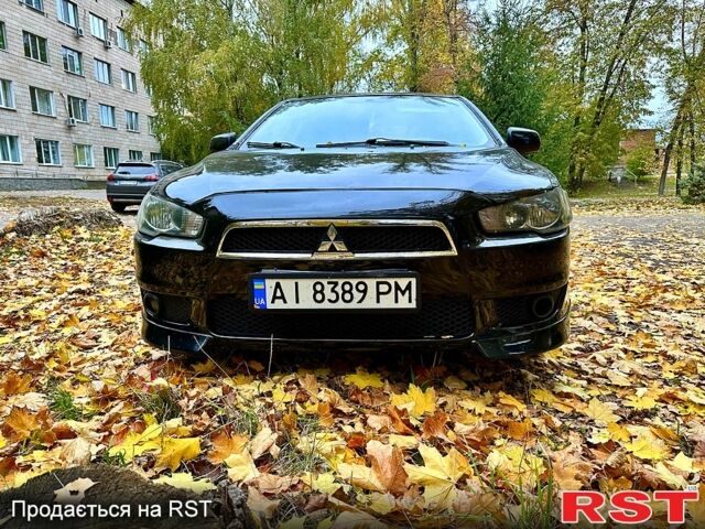 Чорний Міцубісі Lancer, об'ємом двигуна 2 л та пробігом 245 тис. км за 5500 $, фото 1 на Automoto.ua