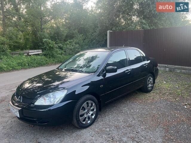 Чорний Міцубісі Lancer, об'ємом двигуна 1.6 л та пробігом 240 тис. км за 4999 $, фото 1 на Automoto.ua