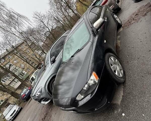 Черный Мицубиси Лансер, объемом двигателя 1.5 л и пробегом 126 тыс. км за 6499 $, фото 1 на Automoto.ua