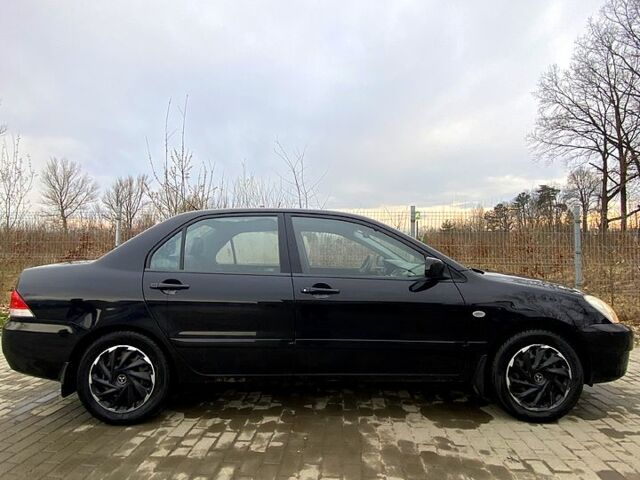 Черный Мицубиси Лансер, объемом двигателя 1.6 л и пробегом 240 тыс. км за 4200 $, фото 1 на Automoto.ua