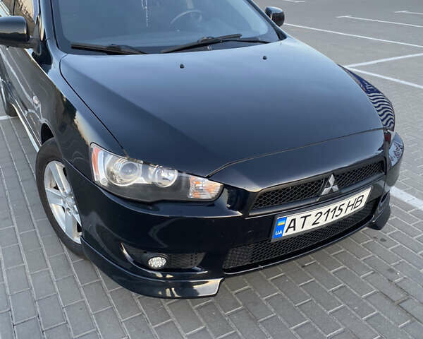 Черный Мицубиси Лансер, объемом двигателя 2 л и пробегом 240 тыс. км за 6600 $, фото 1 на Automoto.ua