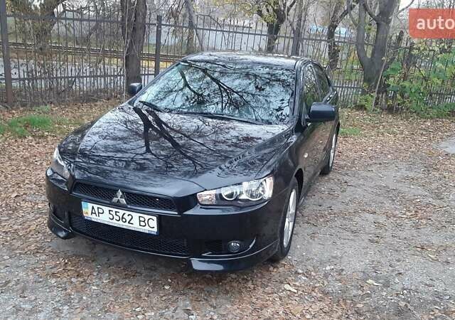 Черный Мицубиси Лансер, объемом двигателя 2 л и пробегом 63 тыс. км за 8000 $, фото 1 на Automoto.ua