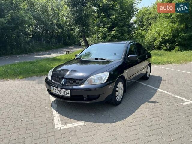 Чорний Міцубісі Lancer, об'ємом двигуна 1.6 л та пробігом 296 тис. км за 4200 $, фото 1 на Automoto.ua