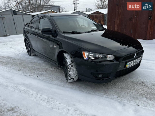 Черный Мицубиси Лансер, объемом двигателя 2 л и пробегом 163 тыс. км за 7500 $, фото 1 на Automoto.ua