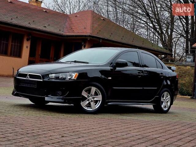 Черный Мицубиси Лансер, объемом двигателя 1.5 л и пробегом 240 тыс. км за 6777 $, фото 1 на Automoto.ua
